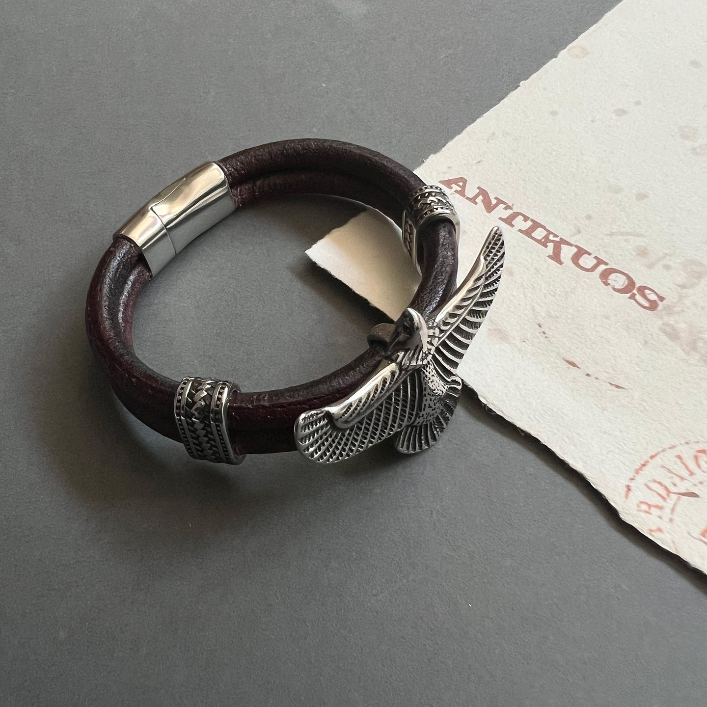 A large leather bracelet in an antique brown colour with an eagle charm as a focal point. Made with high quality soft goat's leather. It measures 12 mm ( 0.5 inches) in width ( 6 mm each leather strand) and has a stainless steel magnetic clasp with a pin for extra security. The eagle is 5 cm wide ( 2 inches) and is made of stainless steel.
.
.
.
#Mens eagle bracelet #eagle bracelet #unisex customized jewellery #leather bracelet #bohemian jewellery