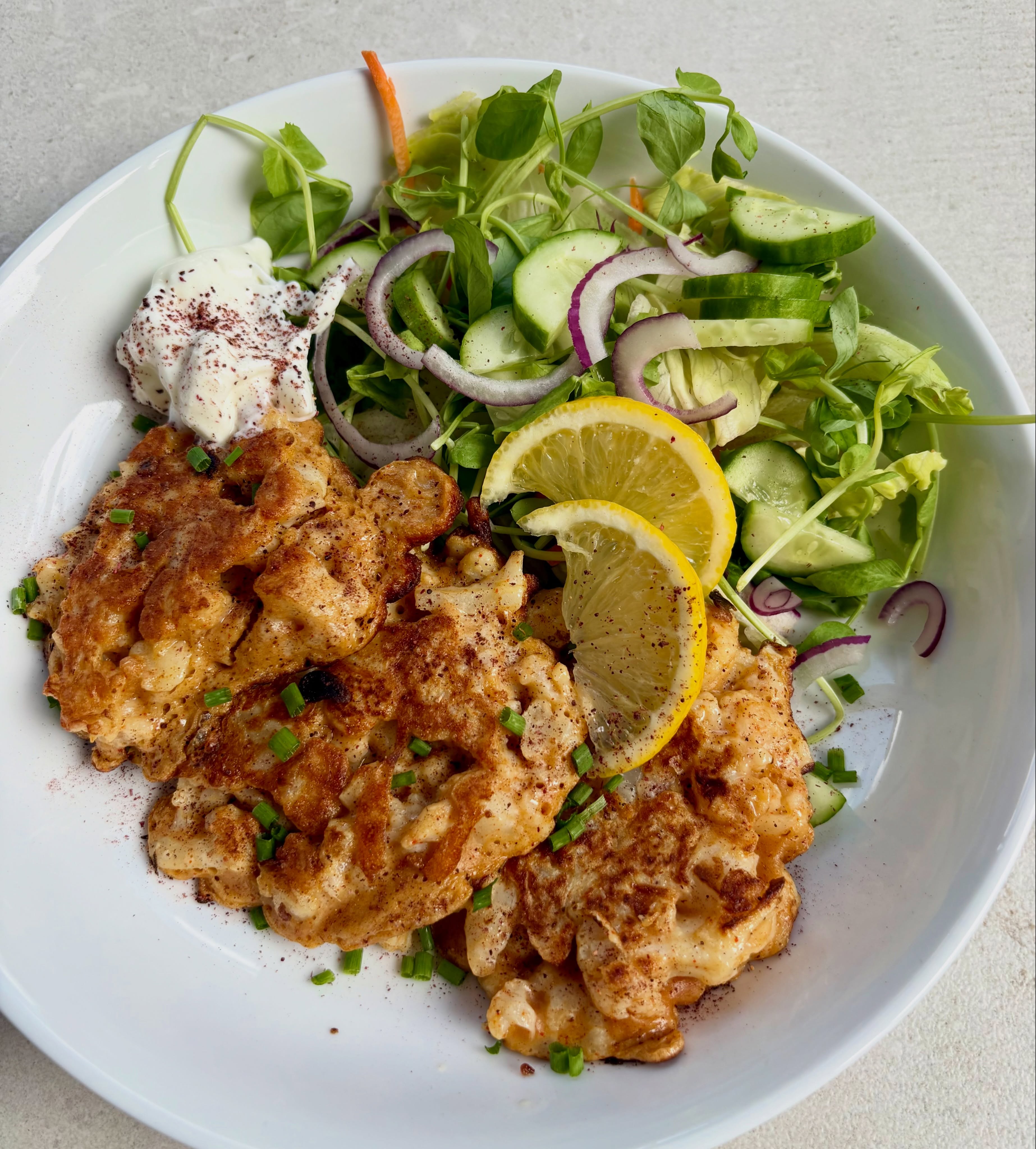 I put these cauliflower fritters up on my stories yesterday and had so many comments, I thought I’d put them up on my grid. I love fritters and love cauliflower so really wanted to try making cauliflower fritters. I looked at a few recipes but didn’t like the sound of mashed soft cauliflower so steamed the florets until just cooked, then added them to a batter which I flavoured with cumin, paprika and seasoning. I wasn’t sure they’d cook well as the cauliflower pieces were kind of floating in the batter, but they actually held together really well. They need a bit more of a flavour lift and I might add onion or spring onion to the next attempt, but not bad for a first attempt!
#cauliflower #fritters #vegetablefritters