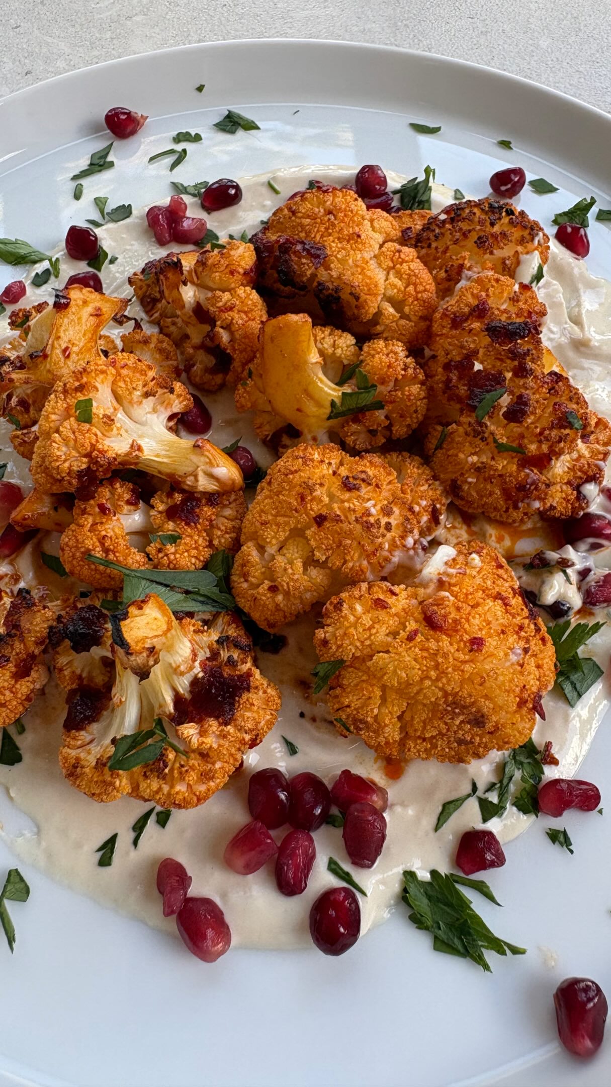 So a couple of days ago I made harissa honey chicken and enjoyed it so much, decided to have the marinade with cauliflower today. Rose harissa, smoked chilli harissa, olive oil, lemon juice and honey poured over cauliflower florets then roasted. Served on a bed of tahini yoghurt and topped with flat leaf parsley and pomegranate seeds. Lovely lunch with some warm flatbread ?
Harissa pastes and tahini - @belazu_co
#middleeasternfood #cauliflowerrecipes #harissa